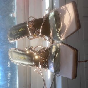 Size 10, Tan colored w/ butterfly straps and a clear pyramid shaped heel.